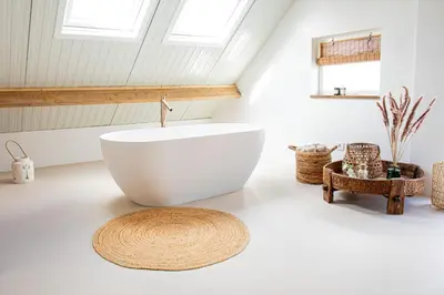 a bathroom with a large white tub in a room at By Tons Huisje inclusief twee fietsen in Zegveld