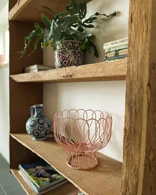 a shelf with a bowl and a vase on it at Group accommodation Huize Blokland on nature farm - 14p in Hem