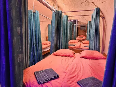 a row of bunk beds in a room at Overnachten aan de Werf in Utrecht