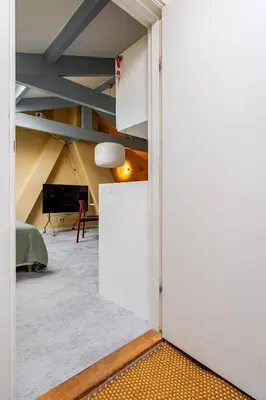 an open door into a room with a living room at Familielogement De Oude Beltoren in Utrecht
