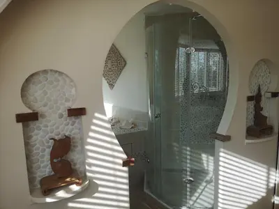 a bathroom with a shower and a glass shower stall at Modern Cozy Asian Style bedroom with Kingsize Spa bath in Westbeemster