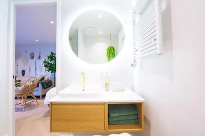a bathroom with a sink and a mirror at Vakantie in Noordwijk in Noordwijk