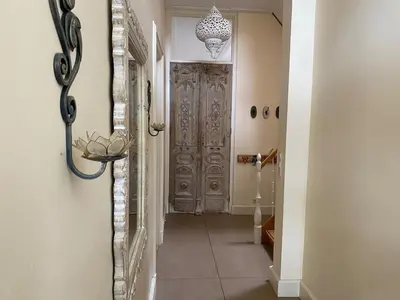 a hallway with a wooden door in a house at Villa free standing 25 min Amsterdam 10 min beach in Akersloot