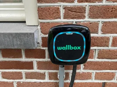 a mailbox on a brick wall with the words willicked at Villa free standing 25 min Amsterdam 10 min beach in Akersloot