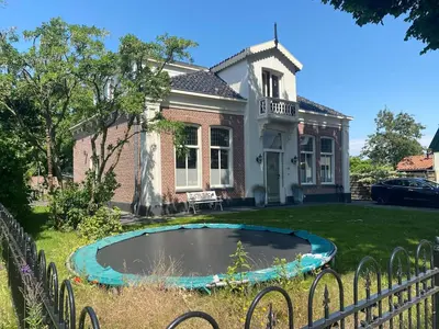 a house with a pond in the yard at Villa free standing 25 min Amsterdam 10 min beach in Akersloot