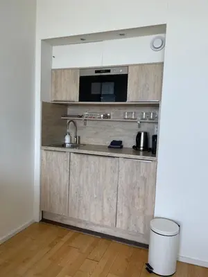 a kitchen with a sink and a counter top at Annet's Studio in Zandvoort