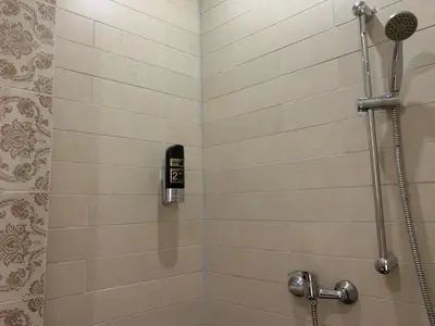 a shower with a phone in a bathroom at Hotel La Belle Vue in Amsterdam