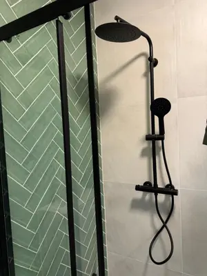 a shower with a shower head in a bathroom at Smile home 3 Wormerveer- Zaanse Schans en Amsterdam appartements in Wormerveer