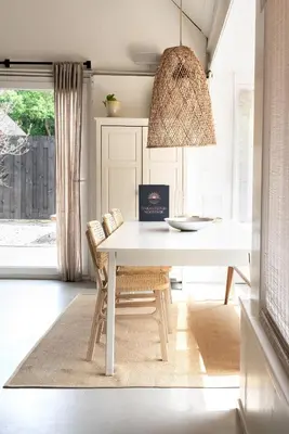 a dining room with a white table and chairs at -Casa Como- nabij het meer, restaurants & keukenhof in Noordwijkerhout