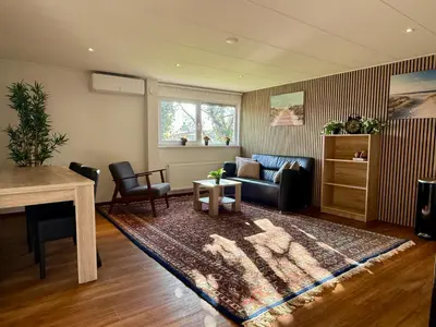 a living room with a couch and a table at Holiday Home Vijfhuizen 2pers Lisa in Vijfhuizen