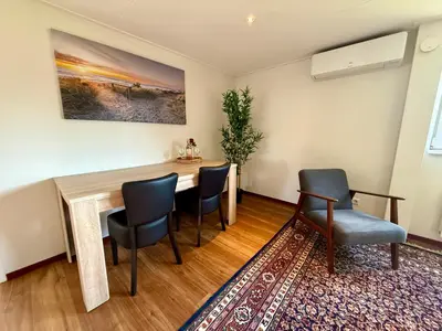 a dining room with a table and chairs at Holiday Home Vijfhuizen 2pers Lisa in Vijfhuizen