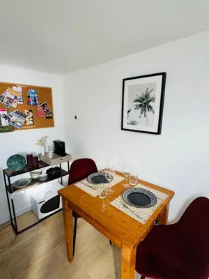 a dining room table with wine glasses on it at BeachHouse Oranje Nassau in Noordwijk aan Zee