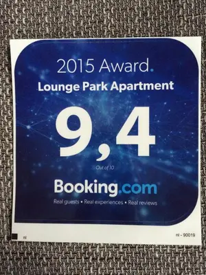a sign for a launch of a louvre park appointment at Lounge Park Apartment in Amsterdam