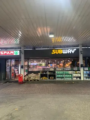 a store with a sub unit sign in a grocery store at Lounge Park Apartment in Amsterdam