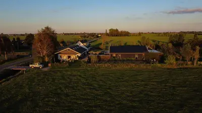 an aerial view of a house in a field at De Lindenhof in Tienhoven