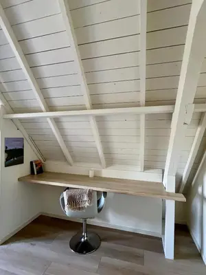 a desk in a room with a ceiling at Rhynhoven Lodge in Hazerswoude-Rijndijk