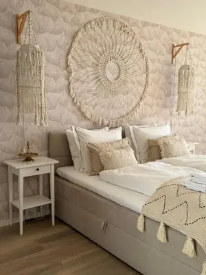 a bedroom with a bed with a large mirror on the wall at Studio Michelle in Zandvoort