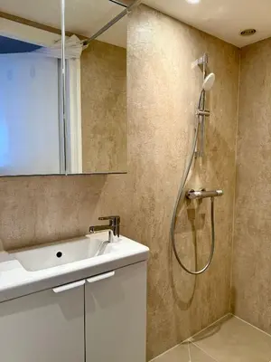 a bathroom with a sink and a shower at Studio Michelle in Zandvoort
