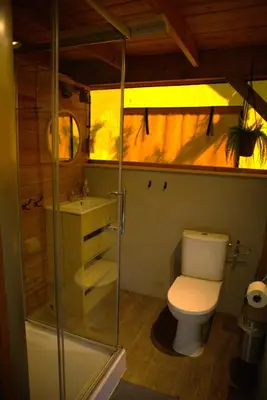a bathroom with a toilet and a sink at Glampingtent de Deiling, de Woudhaven in De Woude