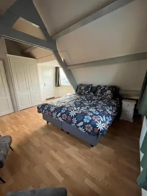 a bedroom with a bed in a room at Bed en Breakfast 1394 in Nederhorst den Berg
