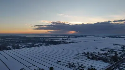 a view of a snow covered roof of a building at Bed en Breakfast 1394 in Nederhorst den Berg