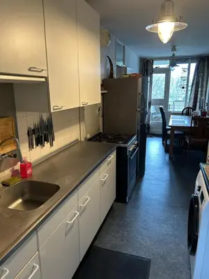 a kitchen with a sink and a stove top oven at B&B Calypso Amsterdam in Amsterdam