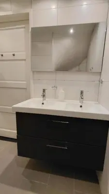 a bathroom with a white sink and a mirror at La Veranda in Zandvoort