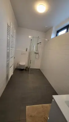a bathroom with a shower and a toilet at B&B Kopwest 8 personen in Purmerend