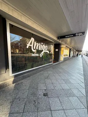 a large store window with an entrance to a store at Amigo Hotel in Amsterdam