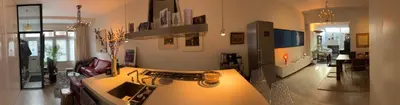a living room with a table with aophone at Quartier Museum Center Amsterdam in Amsterdam
