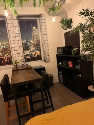 a dining room with a table and a window at The Studio no windows 20 minutes by bus to downtown Amsterdam in Purmerend