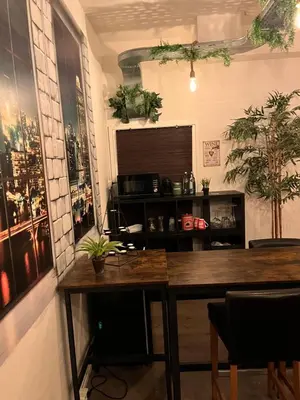 a dining room with a table and some plants at The Studio no windows 20 minutes by bus to downtown Amsterdam in Purmerend