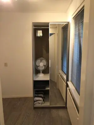 a large mirror in a bathroom with a mirror at BY BABS guesthouse Bergen nh in Bergen