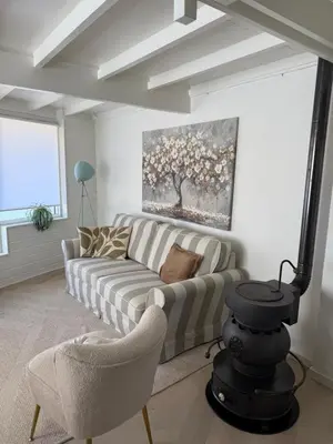 a living room with a couch and two chairs at Stillwater Lodge De Rijd in Nieuwe-Niedorp