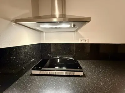 a stove top in a kitchen with a hood at Holiday Home Vijfhuizen in Vijfhuizen