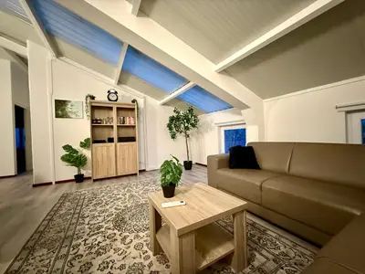 a living room with a couch and a table at Holiday Home Vijfhuizen in Vijfhuizen
