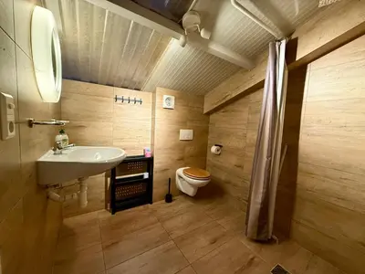 a bathroom with a sink and a toilet at Holiday Home Vijfhuizen in Vijfhuizen