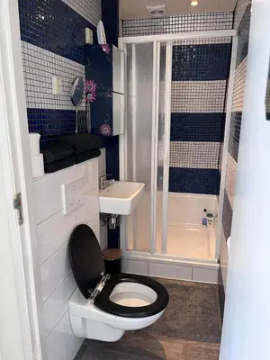 a small bathroom with a toilet and a sink at Comfortabel studio 19 min from downtown Amsterdam in Purmerend