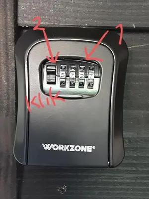 a close up of a work phone with four red arrows at studio Le Garage in Bergen
