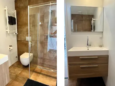 a bathroom with a shower and a sink and a toilet at BeachHouse AAN ZEE in Noordwijk aan Zee