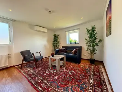 a living room with a couch and a table at Holiday Home Vijfhuizen 2pers in Vijfhuizen