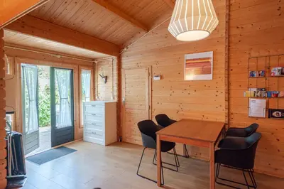 a dining room with a table and chairs at Chalet Zandvoort in Zandvoort