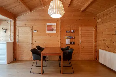 a wooden room with a wooden table and chairs at Chalet Zandvoort in Zandvoort