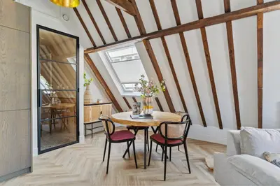 a dining room with a table and chairs at STONEBRIDGE boutique apartments - City centre in Alkmaar