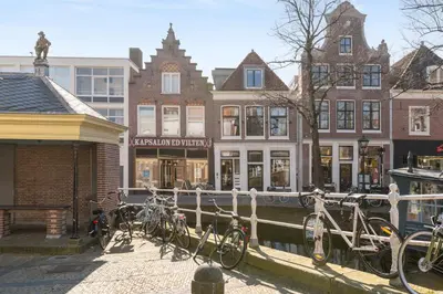 a group of bikes parked in front of buildings at STONEBRIDGE boutique apartments - City centre in Alkmaar