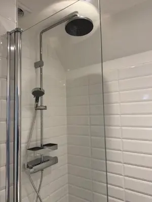 a shower with a glass door at Sunny Beach in Zandvoort