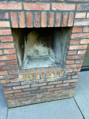 a brick oven with a brick wall at Villa Harry aan Zee in Egmond aan den Hoef