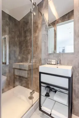 a bathroom with a shower and a sink at Hajé Hotel Restaurant de Lepelaar in Lelystad