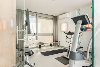 a room with a gym with a treadmill at Villa Red Cedar in Bergen