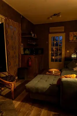 a bedroom with a large bed and a window at Wellness oase Egmond in Egmond aan den Hoef